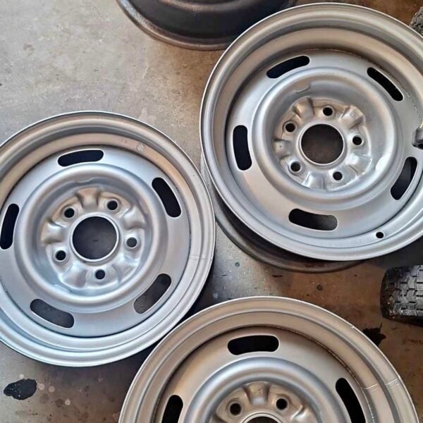 4 Original Chevy Rally Wheels. One
YH, one YW, two FW